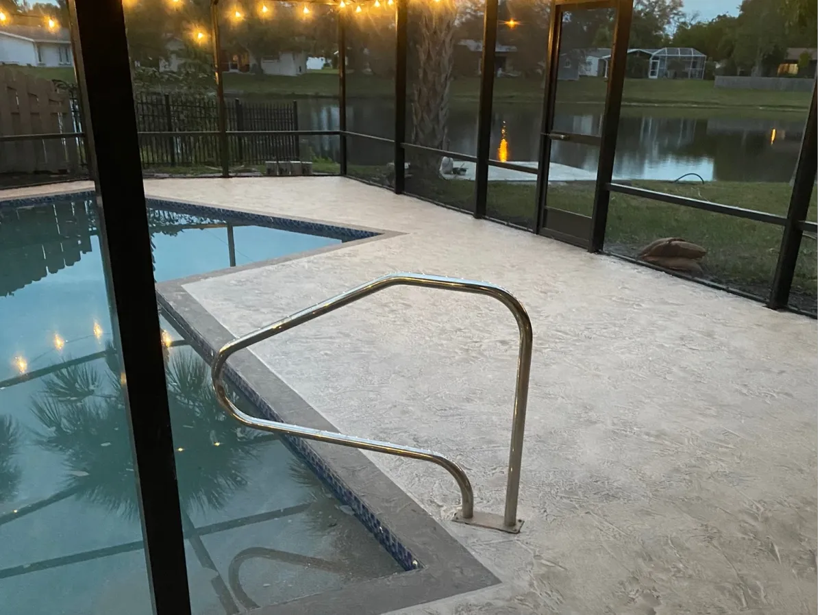Antiqued resurfaced pool deck around a Sarasota pool