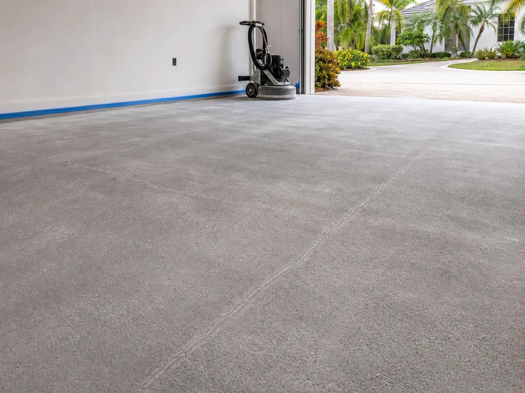 garage floor coating installation process showing prepared concrete surface